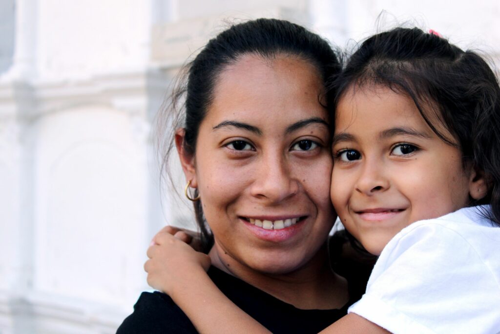 mother and daughter smiling for the camera